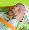Baby in Farm Fresh Newborn Clothing