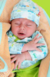 Newborn Baby in Rush Hour outfit