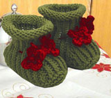 Moss Green Hand Knit Baby Booties with Red Crochet Flowers on the anckle tie 