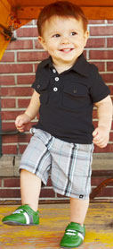 Model wearing See Kai Run Hayden Green Smaller Infant Shoe